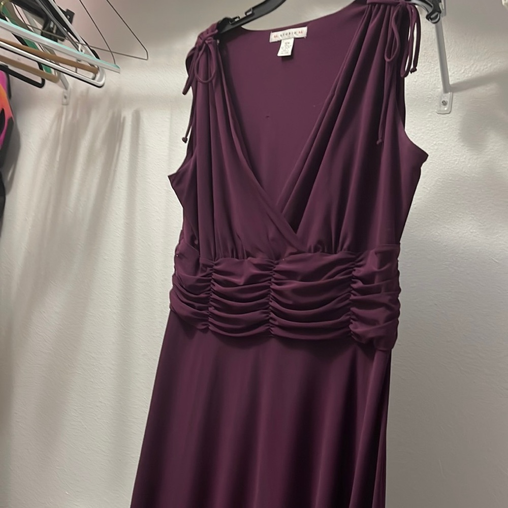 Cute purple dress. Used but still has lots of life left in it.